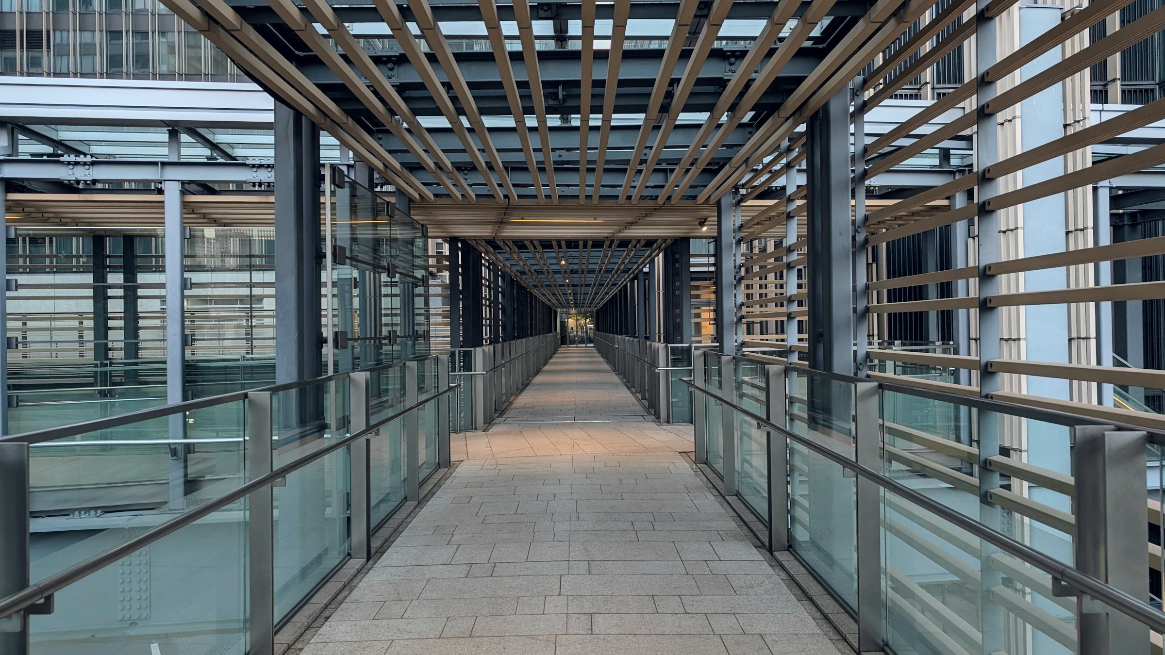Covered glass walkway between buildings